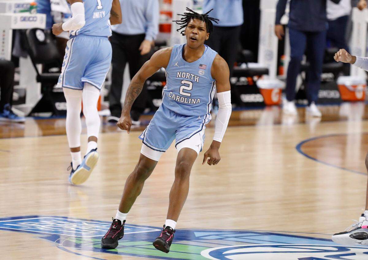 North Carolina’s Caleb Love (2) celebrates after making a basket during the first half of UNCs game against Virginia Tech in the quarterfinals of the ACC Mens Basketball Tournament in Greensboro, N.C., Thursday, March 11, 2021.