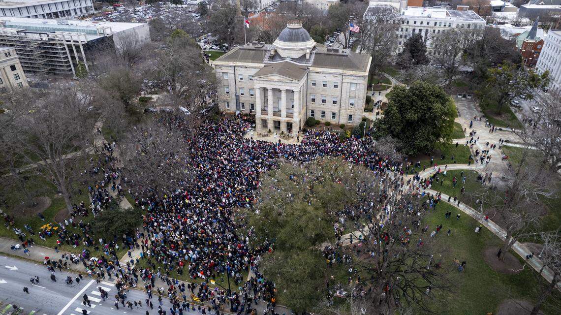 Thousands gather at the North Carolina State Capitol to hear Buddhist monks speak on Saturday. The monks are making a 2,300-mile “Walk for Peace” from Texas to Washington, D.C.