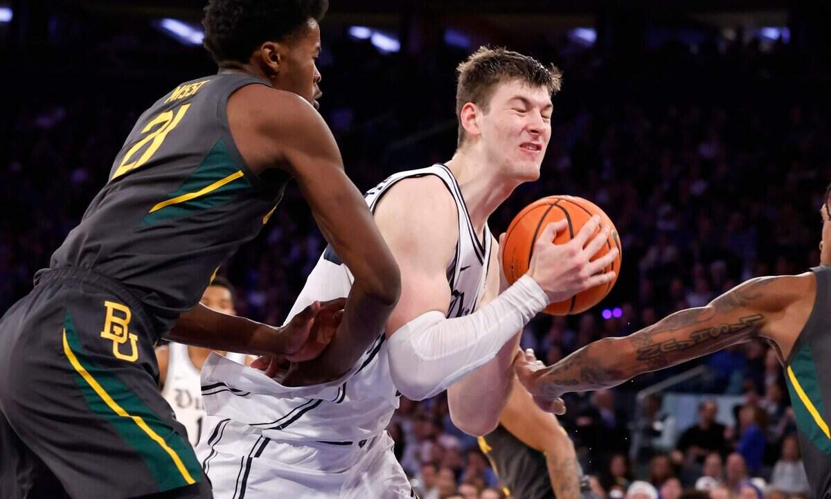 Duke’s Kyle Filipowski (30) heads to the basket as Baylor’s Yves Missi (21) defends during the first half of Duke’s game against Baylor at Madison Square Garden in New York City Wednesday, Dec. 20, 2023.