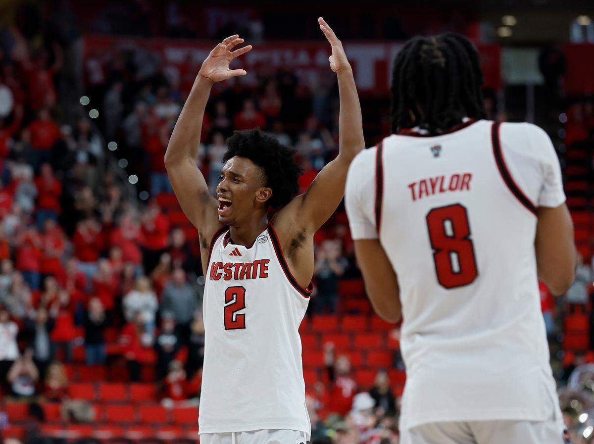 N.C. State’s Paul McNeil celebrates at the end of the Wolfpack’s 85-73 win over Wake Forest on Saturday, Feb. 22, 2025, at Lenovo Center in Raleigh, N.C.