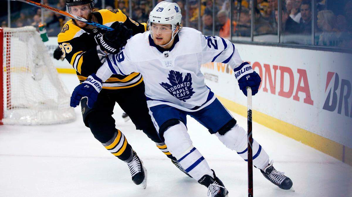 Boston Bruins’ Kevan Miller (86) battles Toronto Maple Leafs’ William Nylander (29) during the first period of Game 5 of an NHL hockey first-round playoff series in Boston, Saturday, April 21, 2018. The Maple Leafs won 4-3.