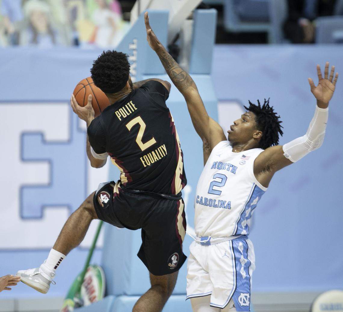Florida State’s Anthony Polite (2) drives to the basket against North Carolina’s Caleb Love (2) during the first half on Saturday, February 27, 2021 in Chapel Hill, N.C.