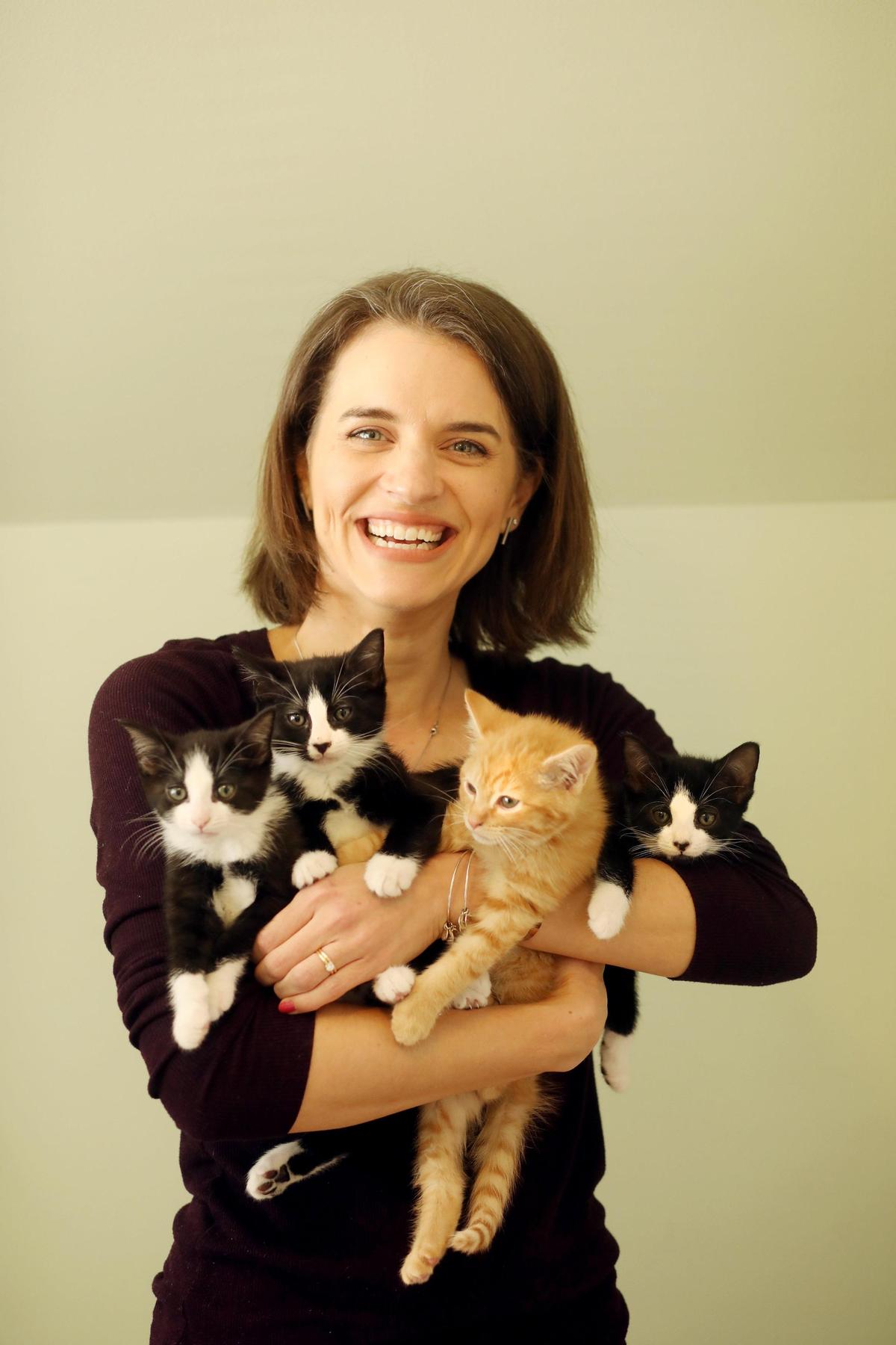 Traci Highsmith, who fosters kittens for SAFE Haven of Raleigh, holds her latest litter of foster kittens at her Raleigh home on Wednesday, April 3, 2019. Highsmith uses an Instagram account with nearly 40,000 followers to raise awareness about pet adoption.