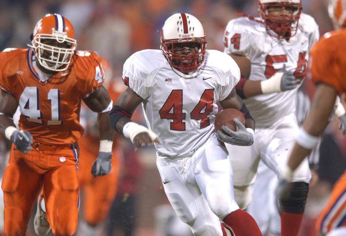N.C. State’s T.A. McLendon makes his way through the Clemson defense during their game on October 24, 2002. McLendon rushed for 178 yards and two scores during the Wolfpack’s 38-6 victory.