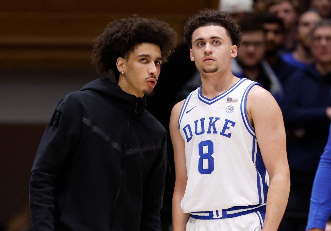 Duke’s Tyrese Proctor talks with Darren Harris (8) during the first half of Duke’s game against Florida State at Cameron Indoor Stadium in Durham, N.C., Saturday, March 1, 2025.