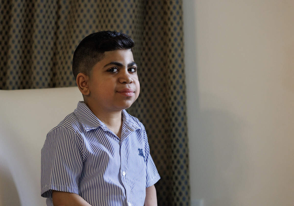 Saleh Ahmad, 8, poses for a portrait at his home in Apex. He received a heart transplant when he was 5.