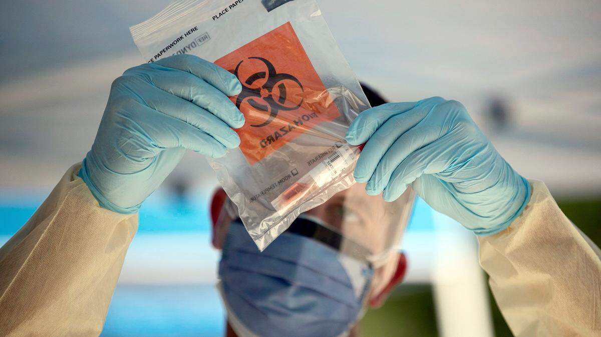 A technician from UNC Health packages a COVID-19 test sample for shipment to the lab on Sept. 8, 2020 in Raleigh, NC.