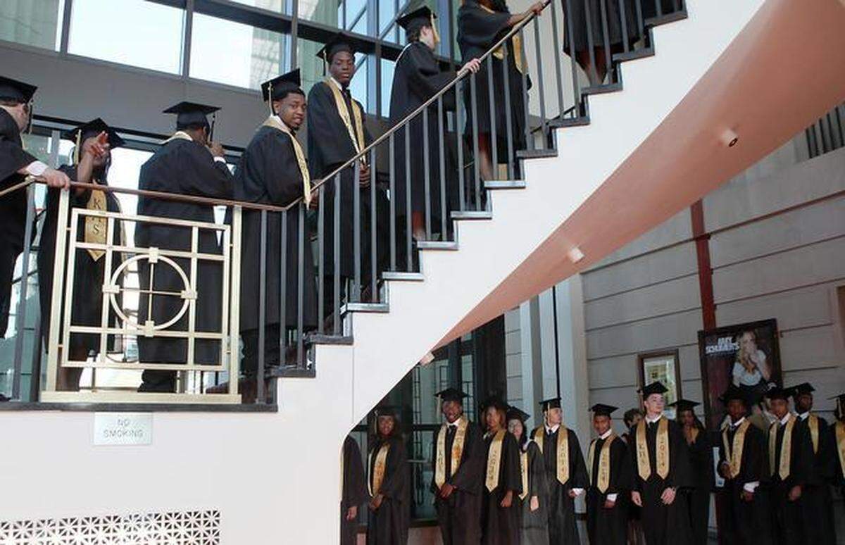 Members of the Knightdale High School Class of 2014 make their way up the steps into the Duke Energy Center for the Performing Arts’ Memorial Auditorium in downtown Raleigh for their graduation in 2014. Wake schools wants 98% of students to graduate. 