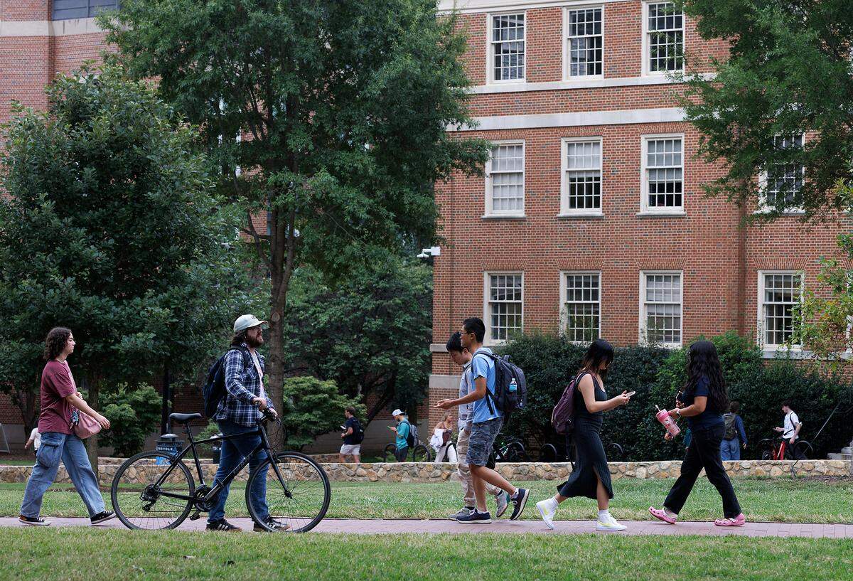 People walk through Polk Place on the campus of UNC-Chapel Hill on Wednesday, Sept. 4, 2024.