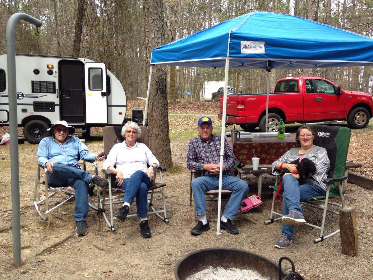 Robert Brooke (L) and his wife, Mildred Brooke, with Bobby Raynor and Sarah Raynor relax at the Parker Creek Campground on Jordan Lake, Thursday, March 29th. The women are sisters and the couples travel together when the weather is warm.
