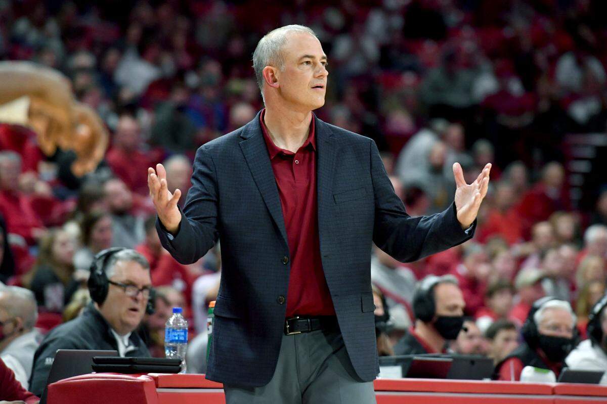 Elon coach Mike Schrage reacts to a call against Arkansas during the second half of an NCAA college basketball game Tuesday, Dec. 21, 2021, in Fayetteville, Ark.
