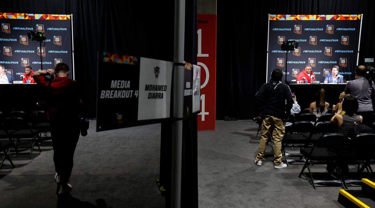 N.C. State’s Mohamed Diarra, left, and DJ Burns Jr. speak to the media in breakout areas before the Wolfpack’s practice at State Farm Stadium in Glendale, Ariz., Friday, April 5, 2024. The Wolfpack will face Purdue in the NCAA Tournament national semifinals Saturday.
