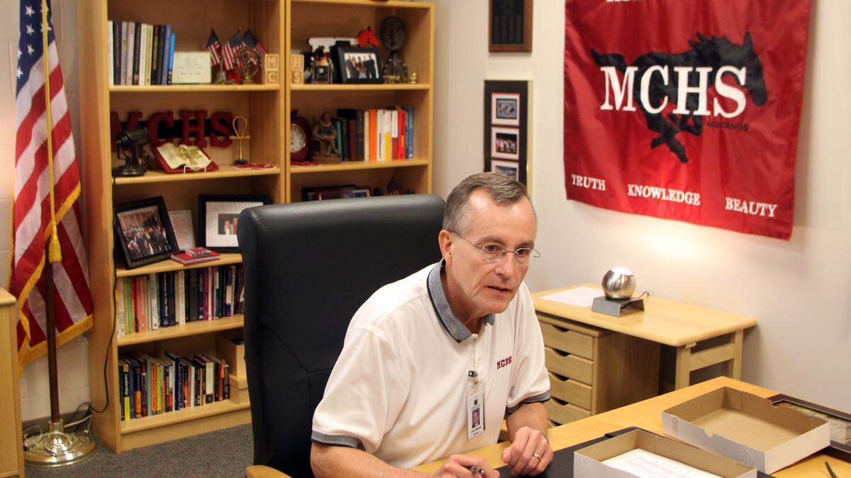 John Williams, the only principal Middle Creek has had, works in his office on Friday, October 28, 2011. Williams is coming out of retirement to lead Middle Creek.