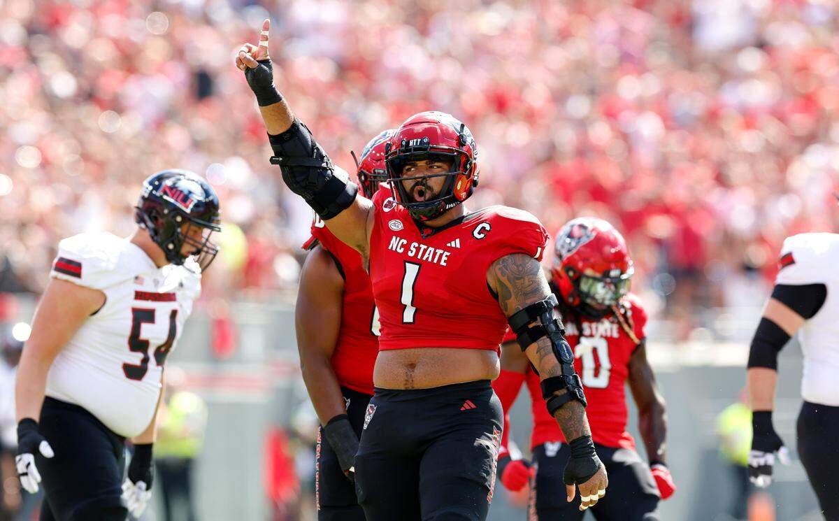 N.C. State defensive end Davin Vann (1) celebrates after stopping Northern Illinois during the first half of the Wolfpack’s victory at Carter-Finley Stadium in Raleigh, N.C., Saturday, Sept. 28, 2024.