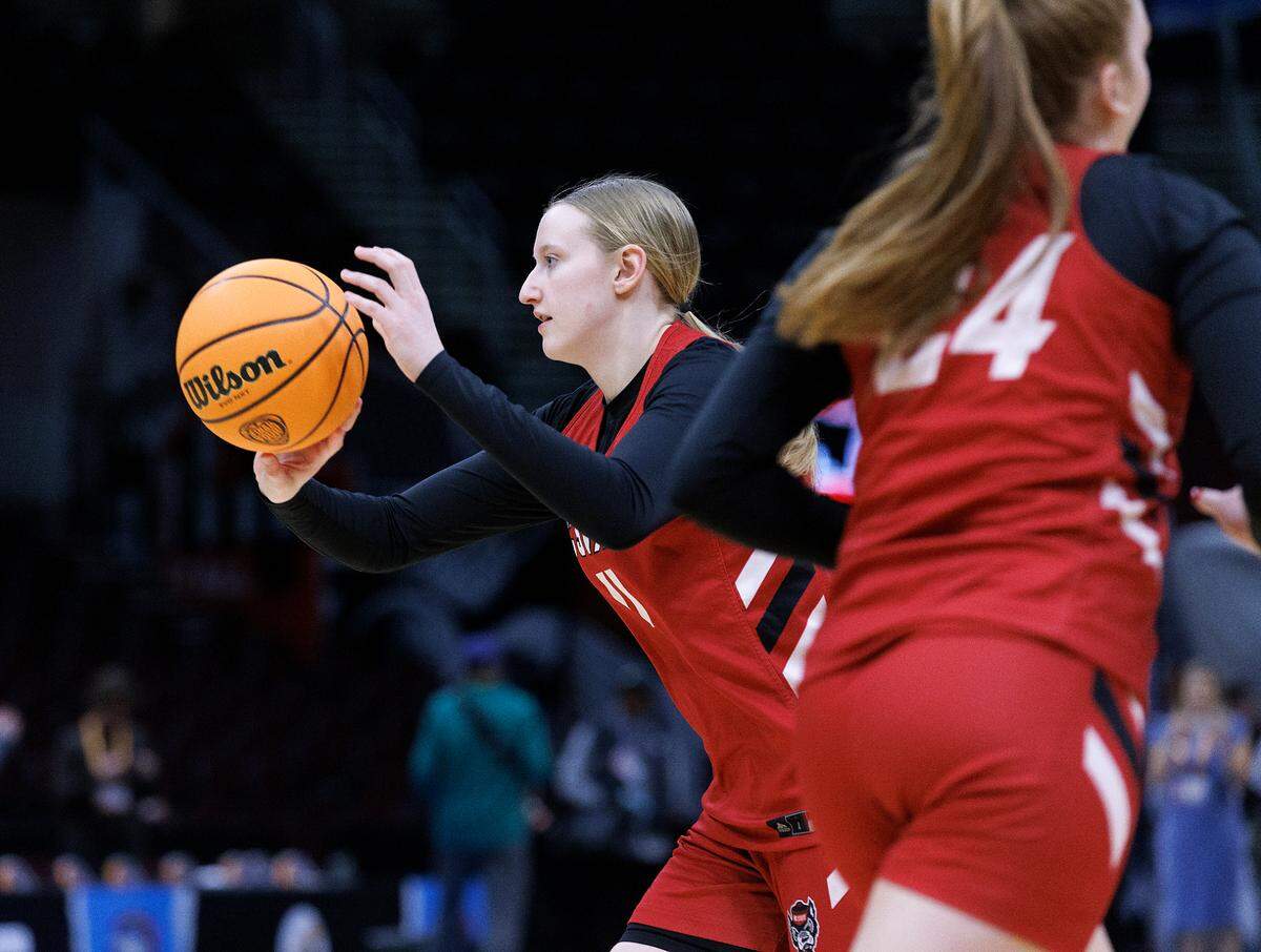 N.C. State’s Maddie Cox throws a pass during practice at Rocket Mortgage FieldHouse on Thursday, April 4, 2024, in Cleveland, Ohio. The Wolfpack will face South Carolina in the Final Four on Friday.