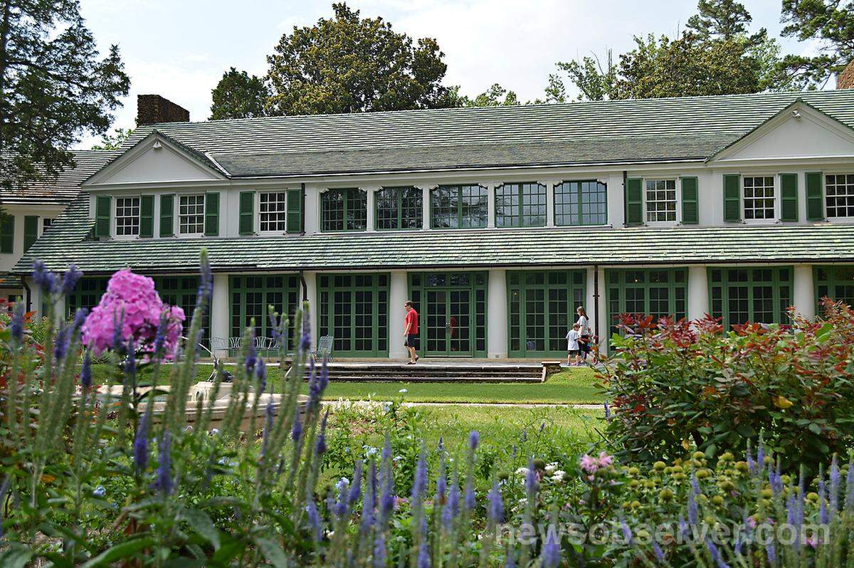Visitors walk along a path at the Reynolda House Museum of American Art in Winston-Salem, N.C. on Sunday, July 13, 2014.