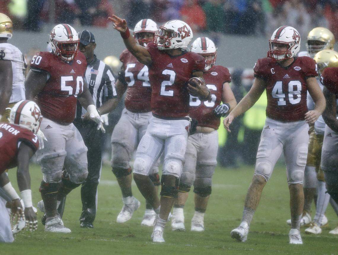 N.C. State quarterback Jalan McClendon (2) celebrates after running for a first down during the second half of N.C. State’s 10-3 victory over Notre Dame at Carter-Finley Stadium in Raleigh, N.C., Saturday, Oct. 8, 2016.