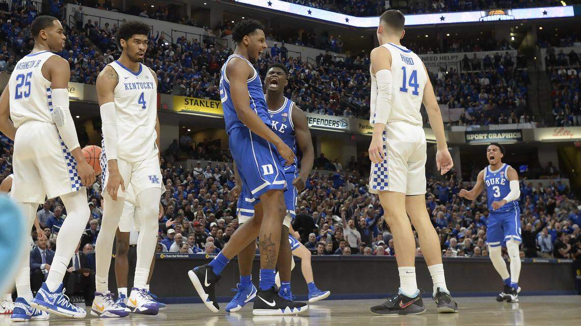 Duke center Marques Bolden (20) reacts with teammates forward Zion Williamson (1) and guard Tre Jones (3) after he is fouled on a reverse lay-up in the first half. Duke defeated Kentucky 118-84 in the Champions Classic at the Bankers Life Fieldhouse in Indianapolis, Indiana, Tuesday, Nov. 6, 2018.