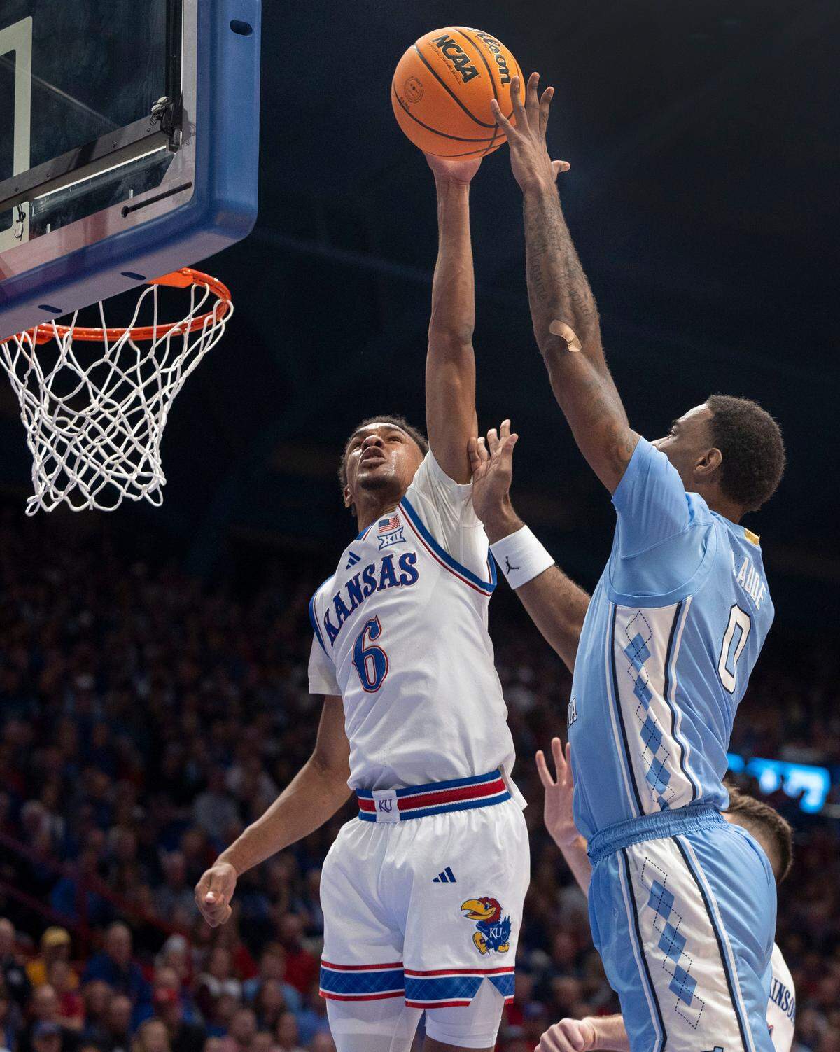 Kansas guard Rylan Griffen (6) blocks a shot by North Carolina’s Ty Claude (0) in the first half on Friday, November 8, 2024 at Allen Fieldhouse in Lawrence, Kansas.