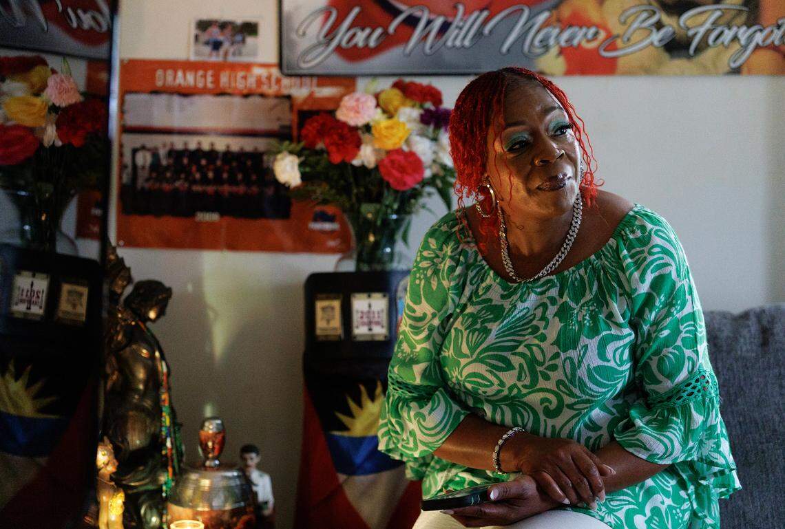 Henrietta Mason sits among photos and belongings of her son, Tyrone Mason. Suspicious from the start about what caused her son’s death, she started her own investigation.