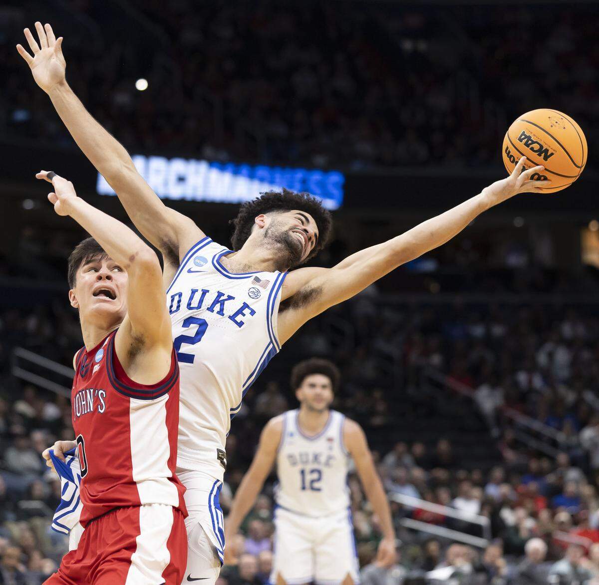 Duke guard Cayden Boozer (2) can’t control the rebound against St. John’s guard Dylan Darling (0) in the first half during the Sweet Sixteen of the NCAA Tournament on Friday, March 27, 2026, at Capital One Arena in Washington, D.C.
