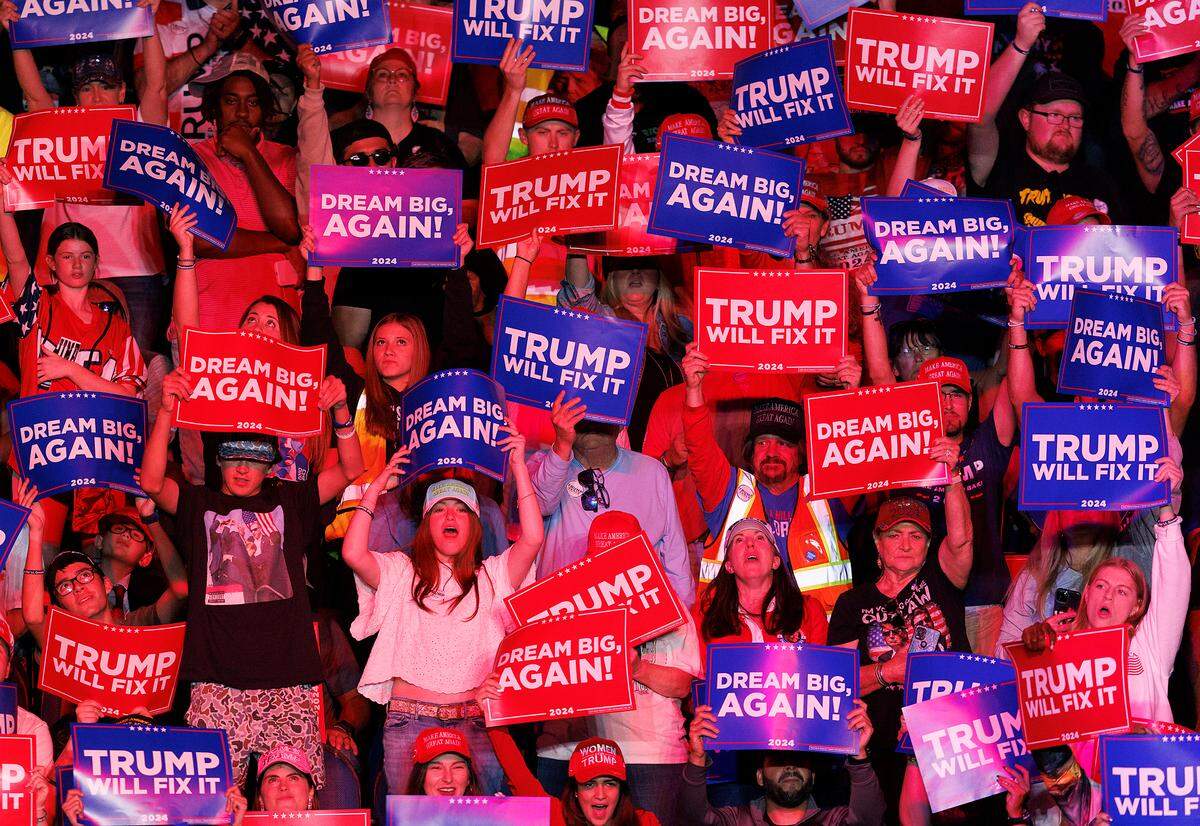 People cheer during remarks by Republican National Committee chairman Michael Whatley at a campaign rally in support of former President Donald Trump at First Horizon Coliseum in Greensboro, N.C. on Saturday, Nov. 2, 2024.