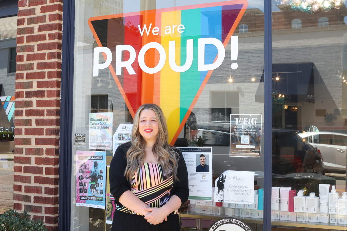 Owner, Maggie Leonhardt, poses outside of Hightide Salon on W Martin Street in downtown Raleigh