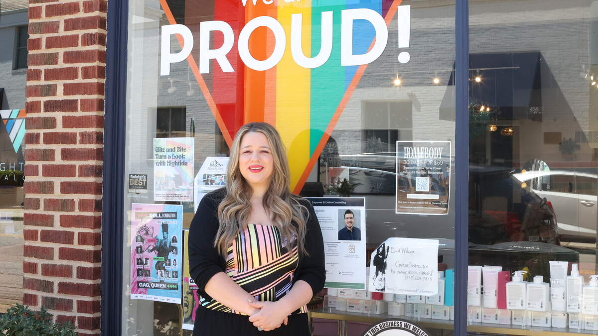 Owner, Maggie Leonhardt, poses outside of Hightide Salon on W Martin Street in downtown Raleigh