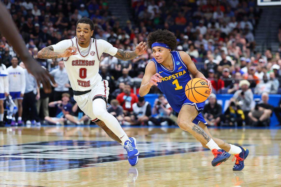 Preston Edmead, right, of the Hofstra Pride drives to the basket against Labaron Philon Jr. of the Alabama Crimson Tide during the teams’ first-round game in the 2026 NCAA Men’s Basketball Tournament at Benchmark International Arena on March 20, 2026 in Tampa, Florida.