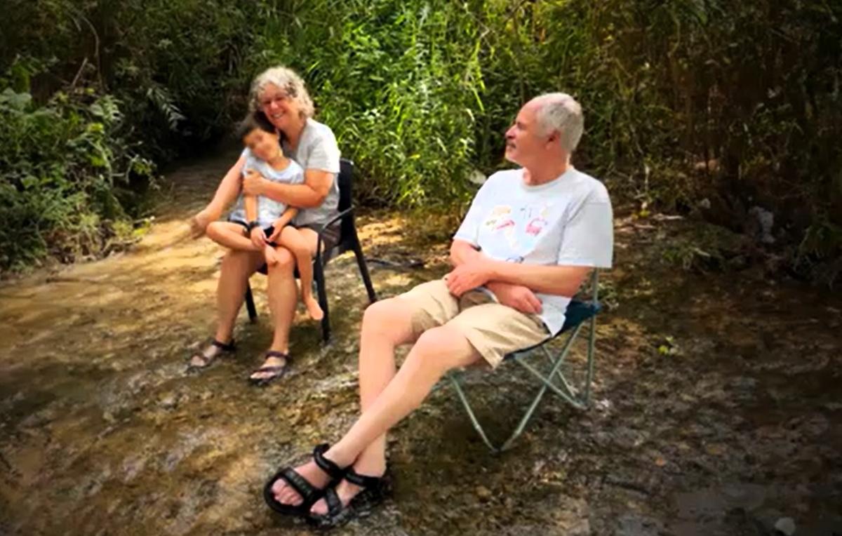 Keith and Aviva Siegel relax with their grandchild during a happier time in their lives in this photo from the Hostages and Missing Families Forum, a volunteer-based organization formed after Hamas militants attacked Israel on Oct. 7, 2023.