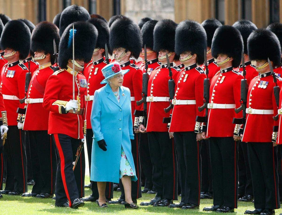 Britain’s Queen Elizabeth II reviews the troops during the presentation of new Queen’s Colour and Regimental Colour to the First Battalion of the Irish Regiment of Foot Guards at Windsor Castle, Windsor, England, Wednesday, May 6, 2009.