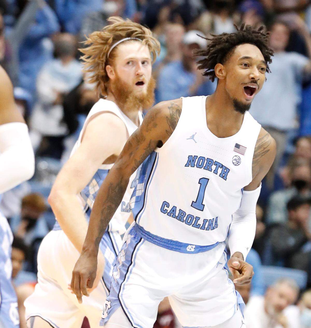 North Carolina’s Leaky Black (1) and Brady Manek (45) head back down the court after Manek hit a three-pointer during the second half of UNC’s 78-68 victory over Virginia Tech at the Smith Center in Chapel Hill, N.C., Monday, Jan. 24, 2022.