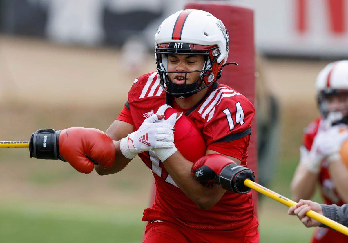 N.C. State tight end Cedd Seabrough (14) runs drills during the Wolfpack’s first spring practice in Raleigh, N.C., Wednesday, March 1, 2023.