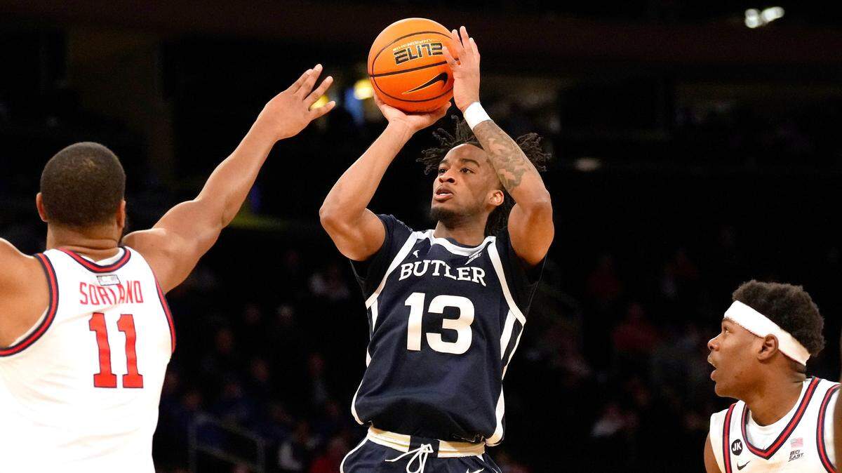 Butler Bulldogs guard Jayden Taylor (13) shoots the ball as St John’s Red Storm forward Joel Soriano (11) defends during their game at Madison Square Garden in March 2023.