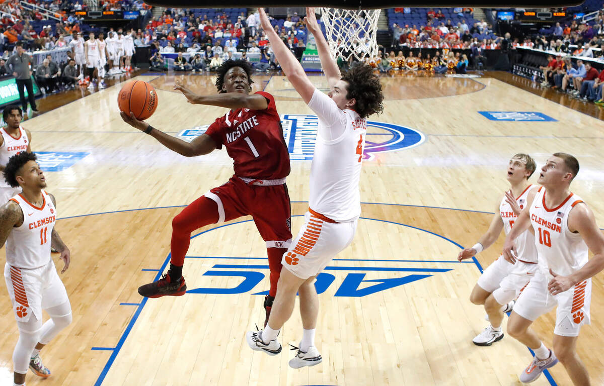 N.C. State’s Jarkel Joiner (1) shoots as Clemson’s Ian Schieffelin (4) defends during Clemson’s 80-54 victory over N.C. State in the quarterfinals of the ACC Men’s Basketball Tournament in Greensboro, N.C., Thursday, March 9, 2023.