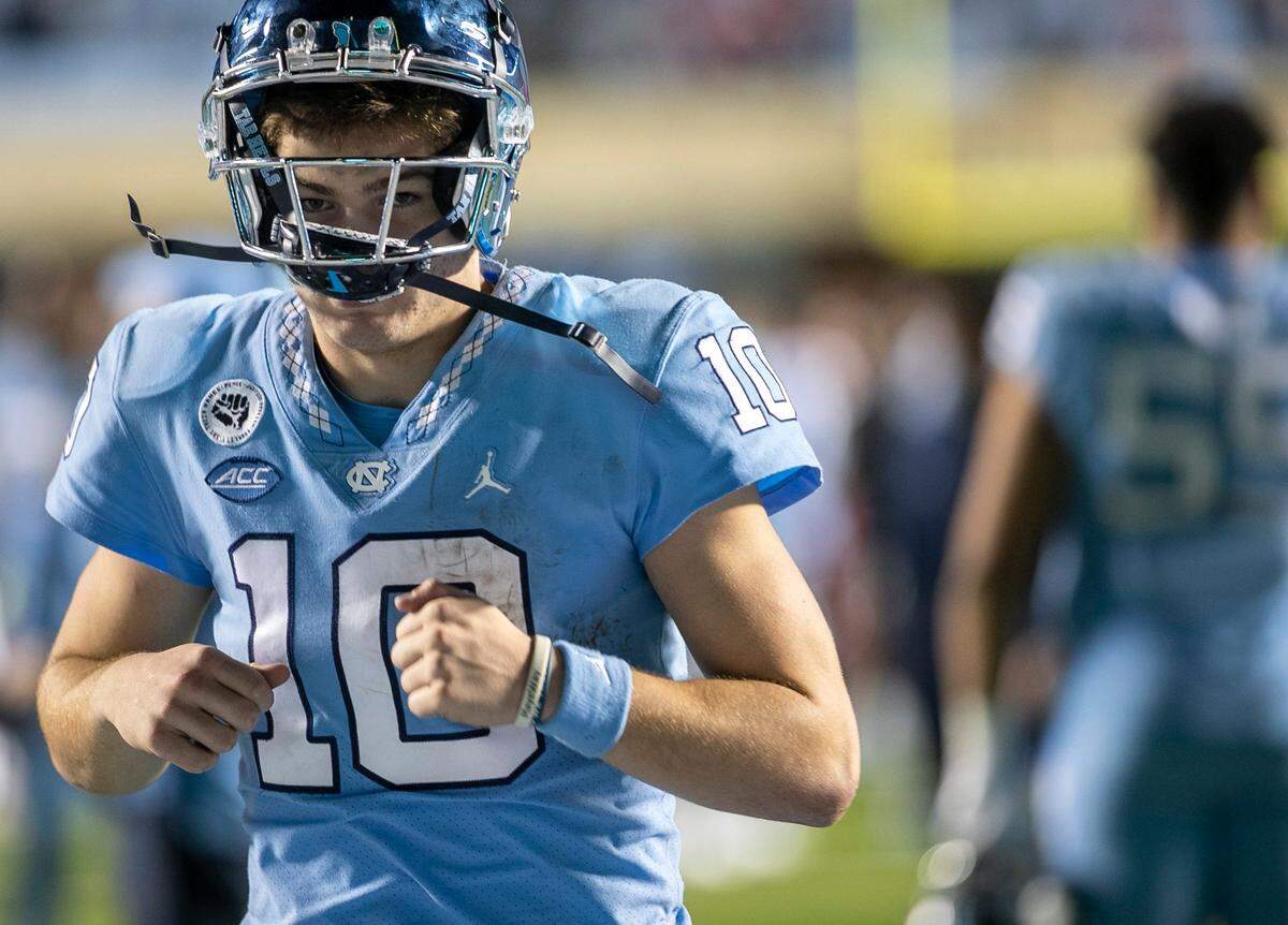 North Carolina quarterback Drake Maye (10) leaves the field following the Tar Heels’ 30-27 loss to N.C.State on Friday, November 25, 2022 at Kenan Stadium in Chapel Hill, N.C.