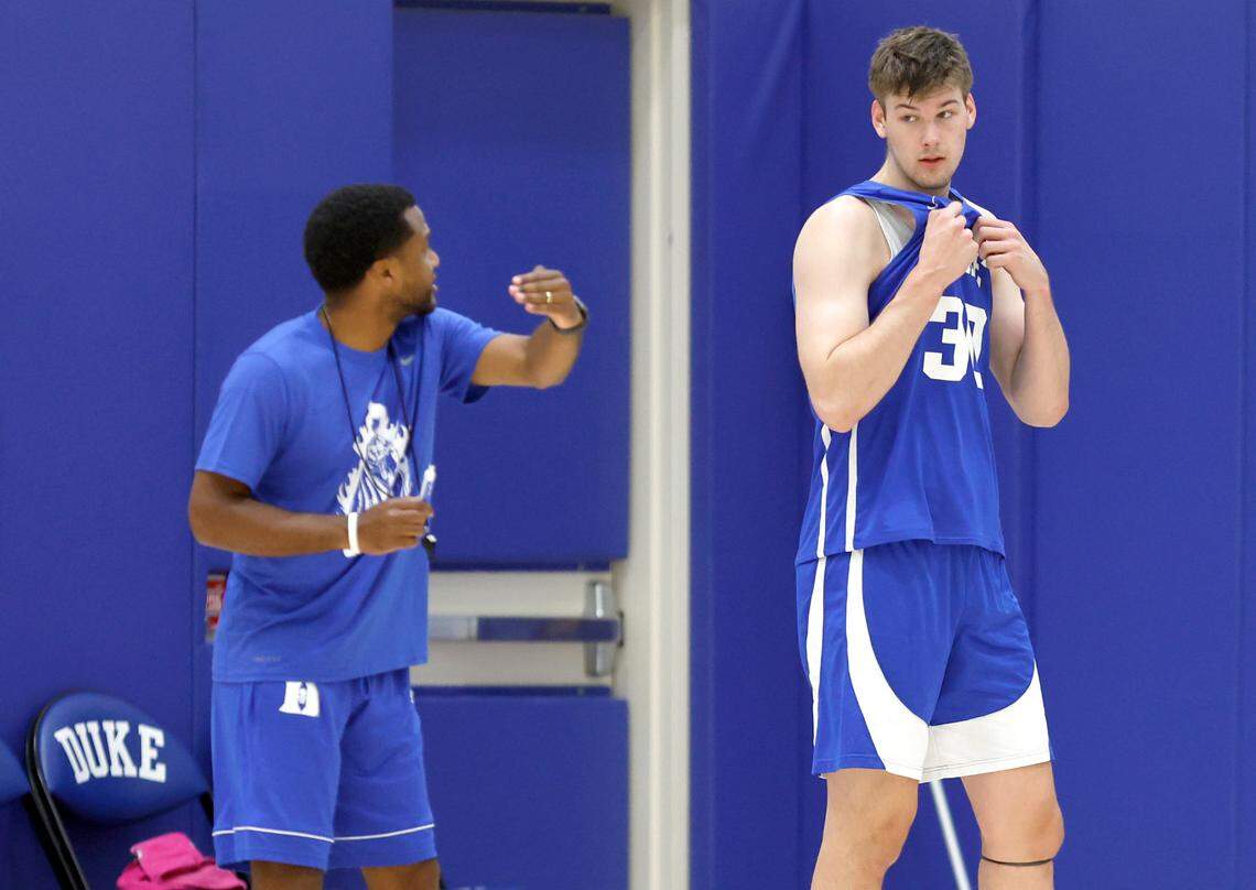 Duke’s Kyle Filipowski (30) listens to associate head coach Jai Lucas during the basketball team’s workout at the K Center practice courts in Durham, N.C., Wednesday, July 12, 2023.