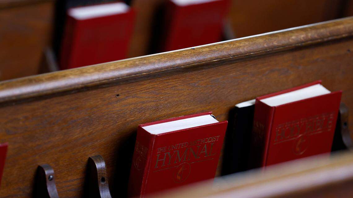 Hymnals and Bibles sit in pews during a service at a Durham, N.C. church on Sunday, July 31, 2022.