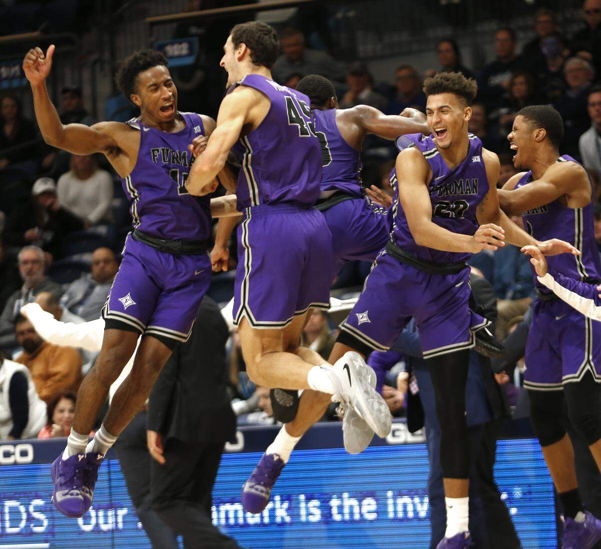 Furman guard Alex Hunter (10) and forward Clay Mounce (45) celebrate after their team defeated Villanova 76-68 in overtime in an NCAA college basketball game, Saturday, Nov. 17, 2018, in Villanova, Pa.
