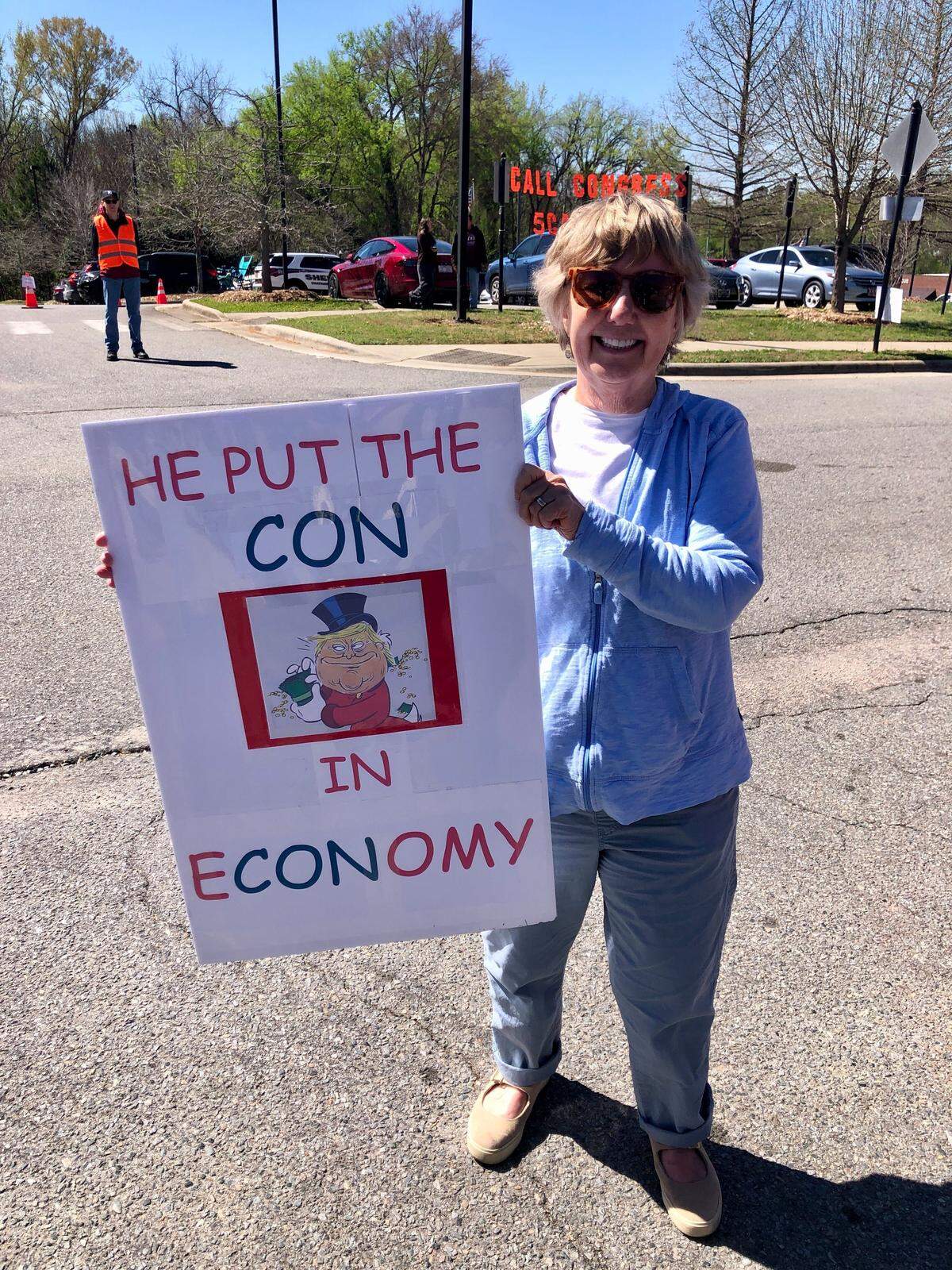 Susan Worley of Chapel Hill at the No Kings rally in Pittsboro Saturday morning. Worley said she would attend a second event in her hometown in the afternoon.