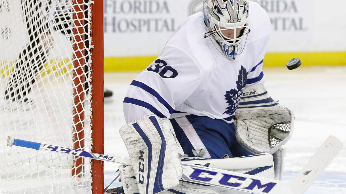 Goalie Antoine Bibeau, who signed Thursday with the Carolina Hurricanes, makes a save on a shot by the Tampa Bay Lightning while playing for the Toronto Maple Leafs in December 2016. (AP Photo/Chris O’Meara)