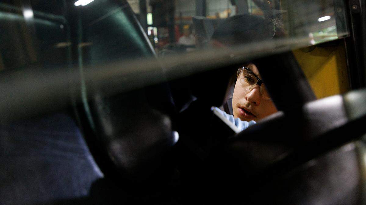 Dominic Cavallini, a Wake Technical Community College student, replaces parts of a forklift at The Gregory Poole Equipment Company in Raleigh, N.C., on Thursday, July 18, 2024. Cavallini works at Gregory Poole through Wake Tech’s apprenticeship program.