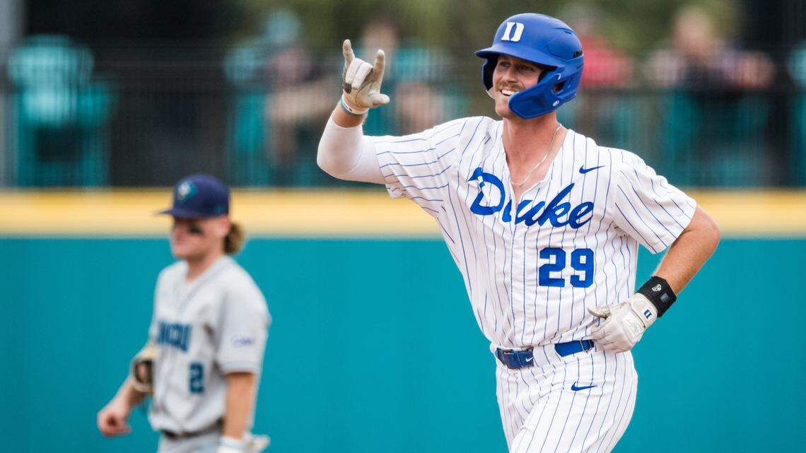 Duke Blue Devils designated hitter MJ Metz signals to his dugout after hitting his third home run of the game in Duke’s 12-3 win over UNC Wilmington in the NCAA Tournament Conway Regional at Springs Brooks Stadium.