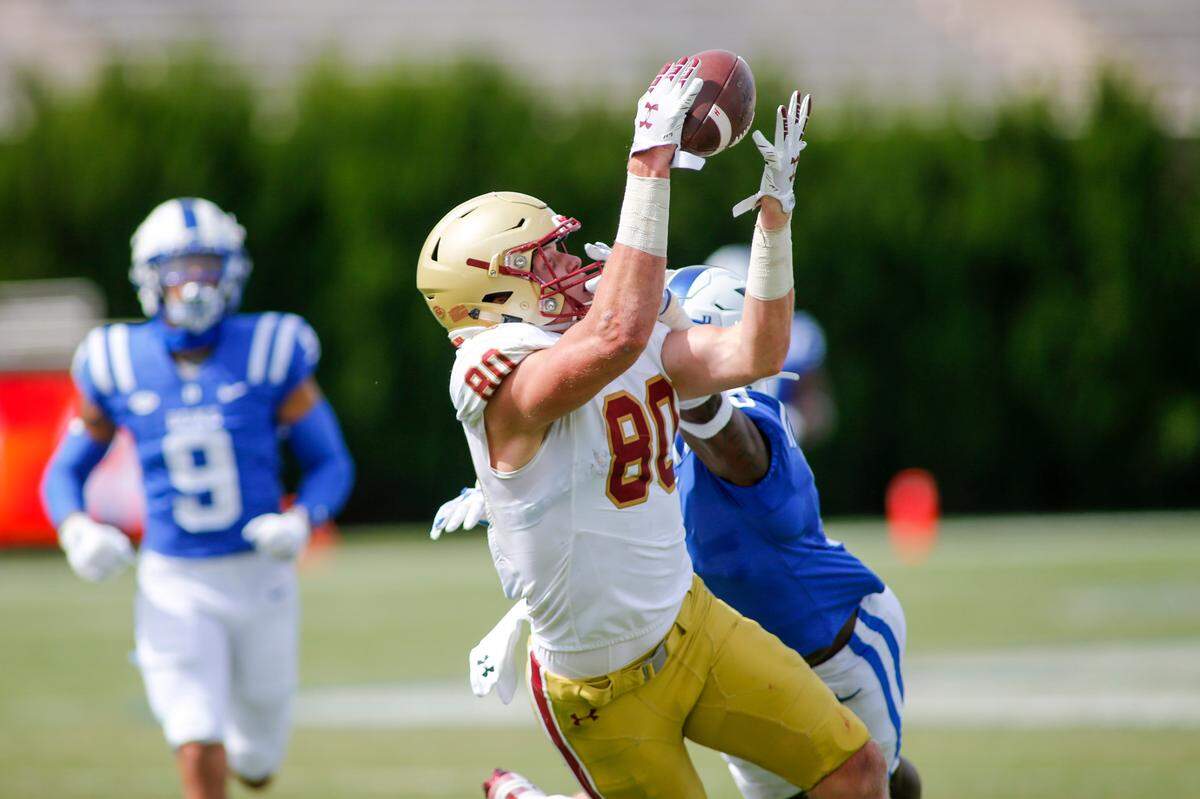 Boston College Eagles tight end Hunter Long (80) catches a pass against Duke Blue Devils safety Marquis Waters in the fourth quarter at Wallace Wade Stadium. The Boston College Eagles won 26-6. Mandatory Credit: Nell Redmond-USA TODAY Sports