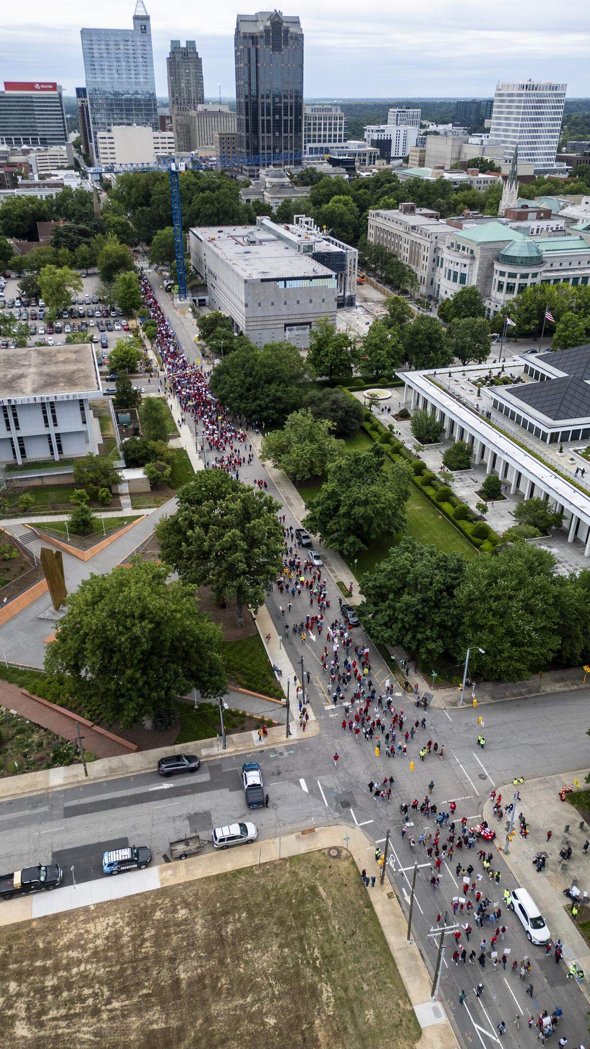 Thousands of educators and public education supporters march along North Wilmington Street following a rally on Halifax Mall in Raleigh on Friday, May 1, 2026, calling for higher pay, increased school funding and higher taxes on corporations during a “Kids Over Corporations” rally and march at the North Carolina General Assembly organized by the North Carolina Association of Educators. At least 22 school districts canceled classes because many employees requested the day off.