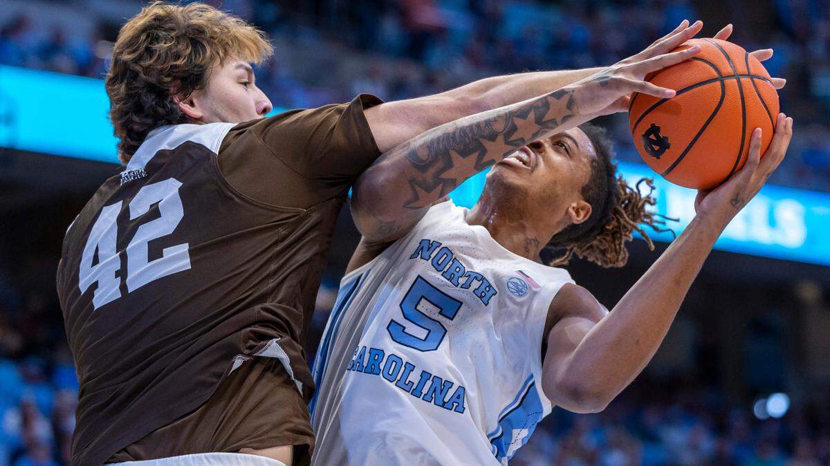 North Carolina’s Armando Bacot (5) muscles his way to the basket against Lehigh’s J.T. Tan (42) in the first half on Sunday, November 12, 2023 at the Smith Center in Chapel Hill, N.C.
