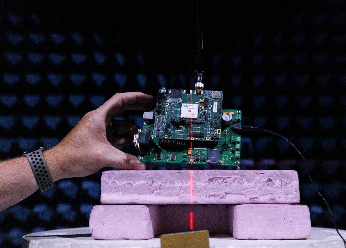Jordan Stearns, operations manager at the Wireless Research Center of NC, holds a device used to test equipment inside one of the facility’s anechoic chambers in Wake Forest, N.C.