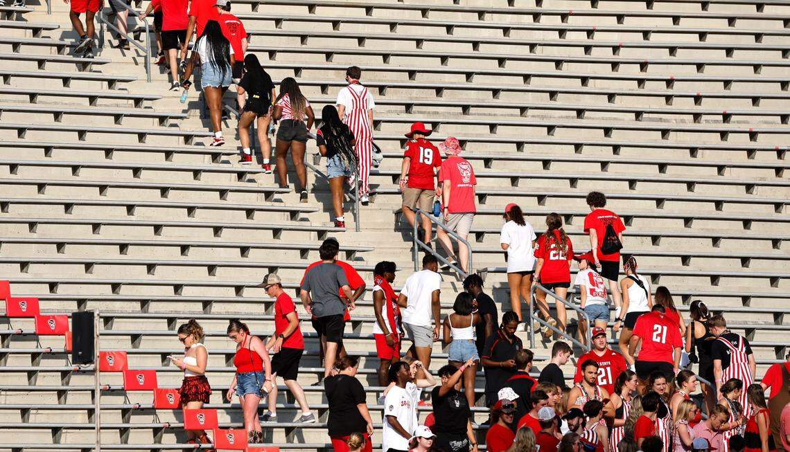 Fans head up the stairs after they were told to move because of a lightning delay before N.C. State’s game against Western Carolina at Carter-Finley Stadium in Raleigh, N.C., Thursday, August 29, 2024.