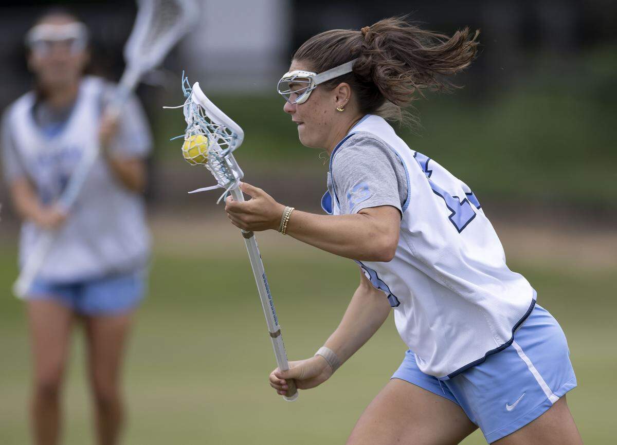 North Carolina midfielder Kate Levy (13) cradles the ball during a drill with defenders at the Tar Heels’ practice on Wednesday, May 6, 2026 in Chapel Hill, N.C