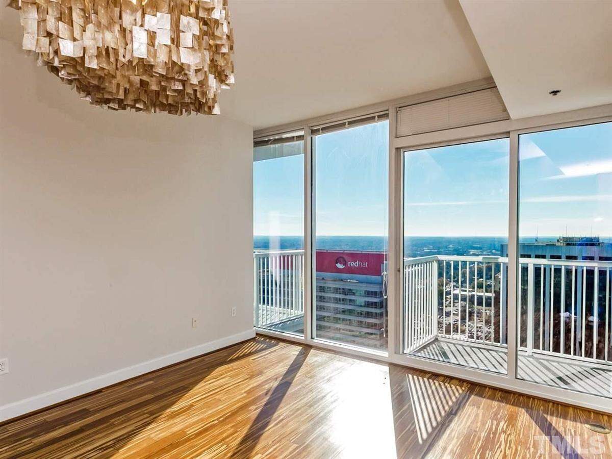 High-rise two-bedroom, two-bathroom luxury condo unit with 1,138 square feet on the 25th floor of the PNC Plaza tower at 301 Fayetteville Street Unit 2510.